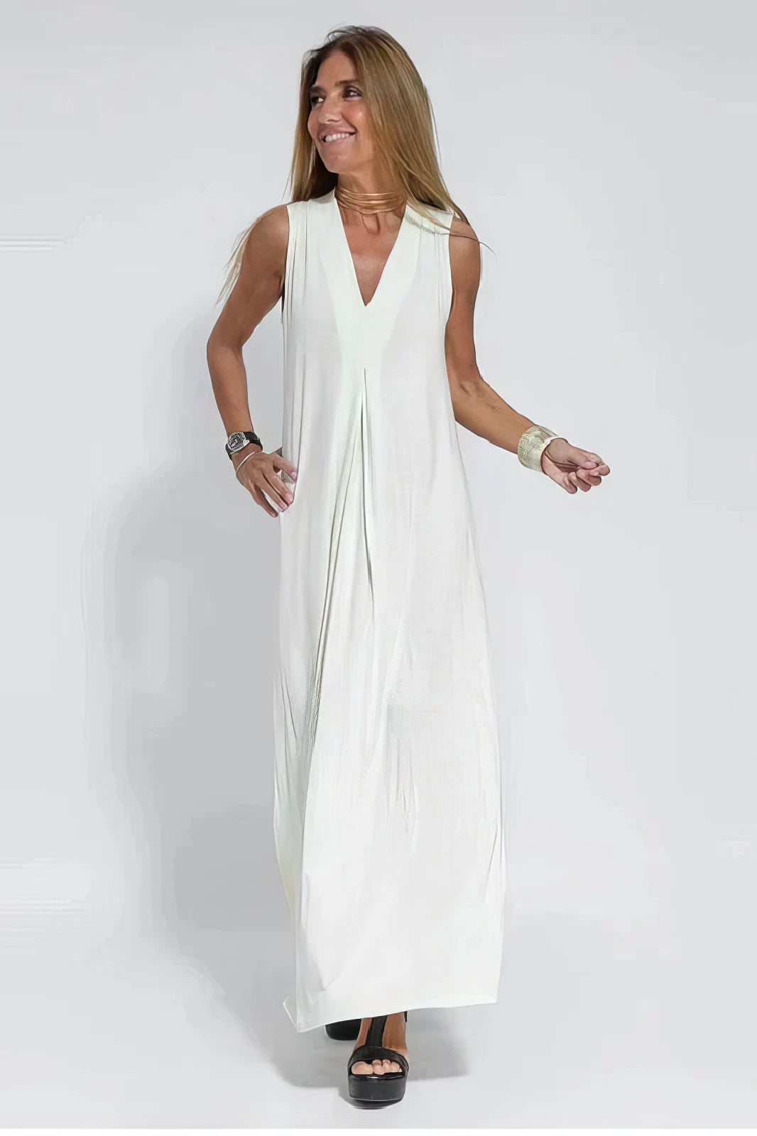 Elegant long dress with coordinated cardigan set, flowing silhouette in neutral tones, sophisticated layered look